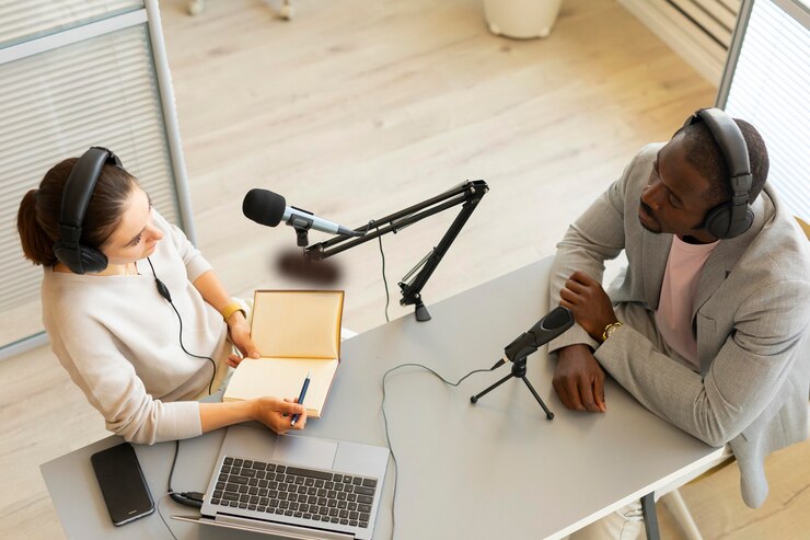 Hosts engaging in a podcast conversation